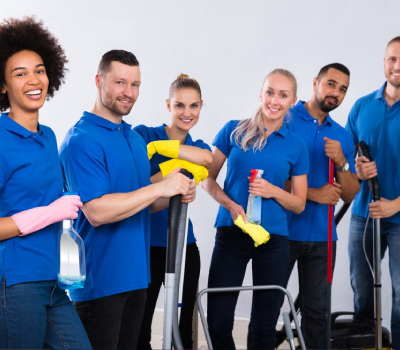 six employees in blue polos